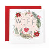Hotchpotch Luxury Christmas Card To A Lovely Wife, Botanical Wreath With Red Poinsettias And Silver Foil Heart Detail, 6 x 6 Inches