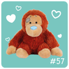 Plush monkey toy with a bandage on a teal background with heart shapes