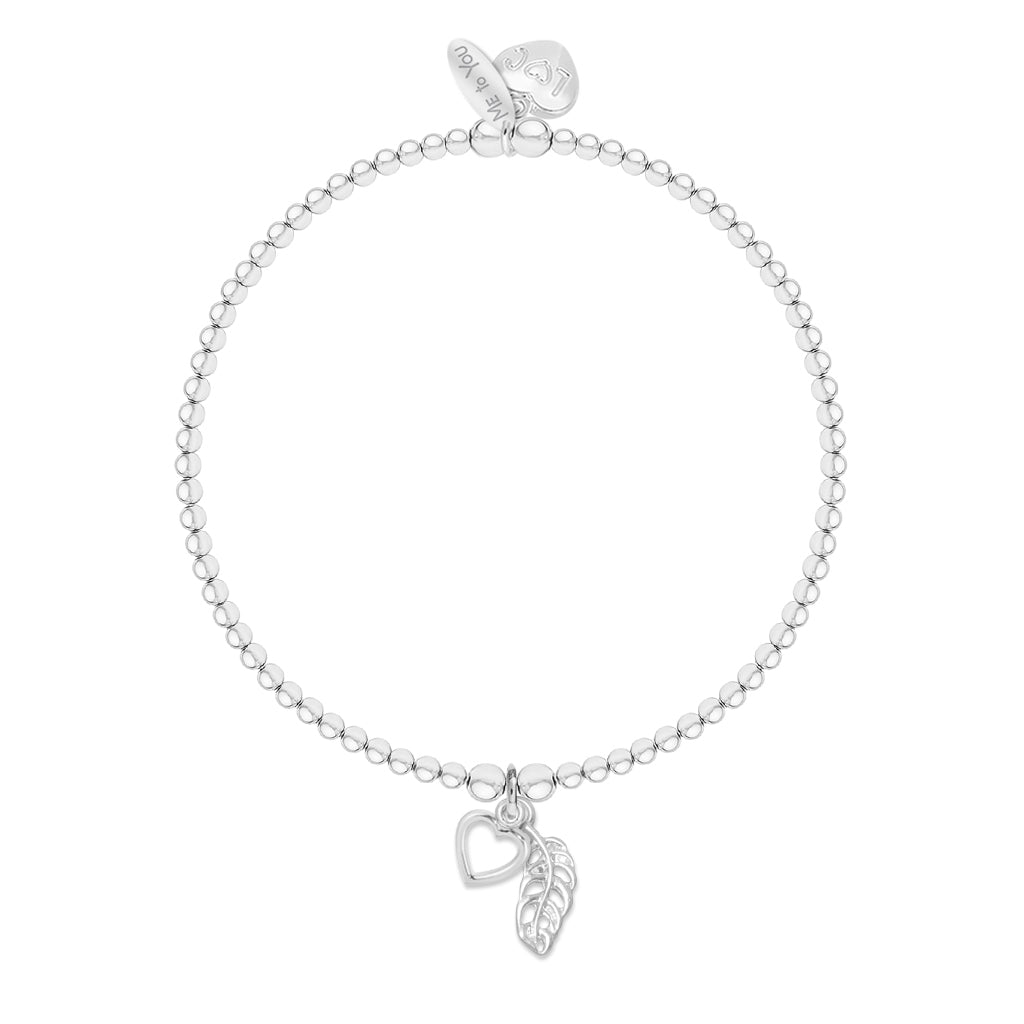 A silver beaded bracelet with a heart and feather pendant, displayed on a clean white background.