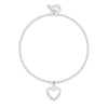 A silver beaded bracelet with a dangling open heart charm set with small clear stones, shown on a plain white background.