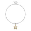 A delicate silver beaded bracelet with a gold star charm set with small clear stones, displayed on a clean white background.