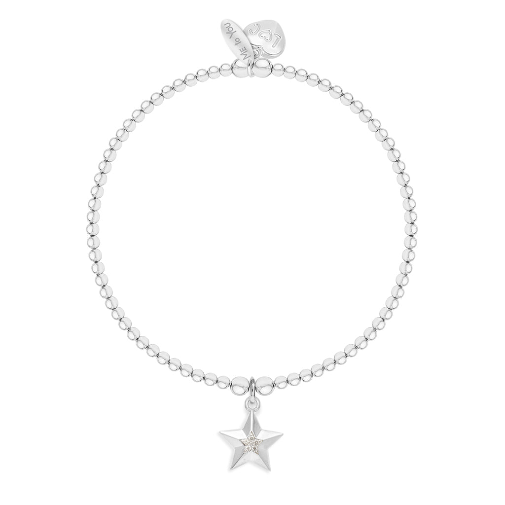 A silver beaded bracelet with a dangling star charm set with a small clear crystal, shown on a plain white background.