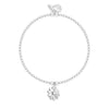 A silver beaded bracelet with a small flower charm featuring a clear central stone, displayed on a clean white background.