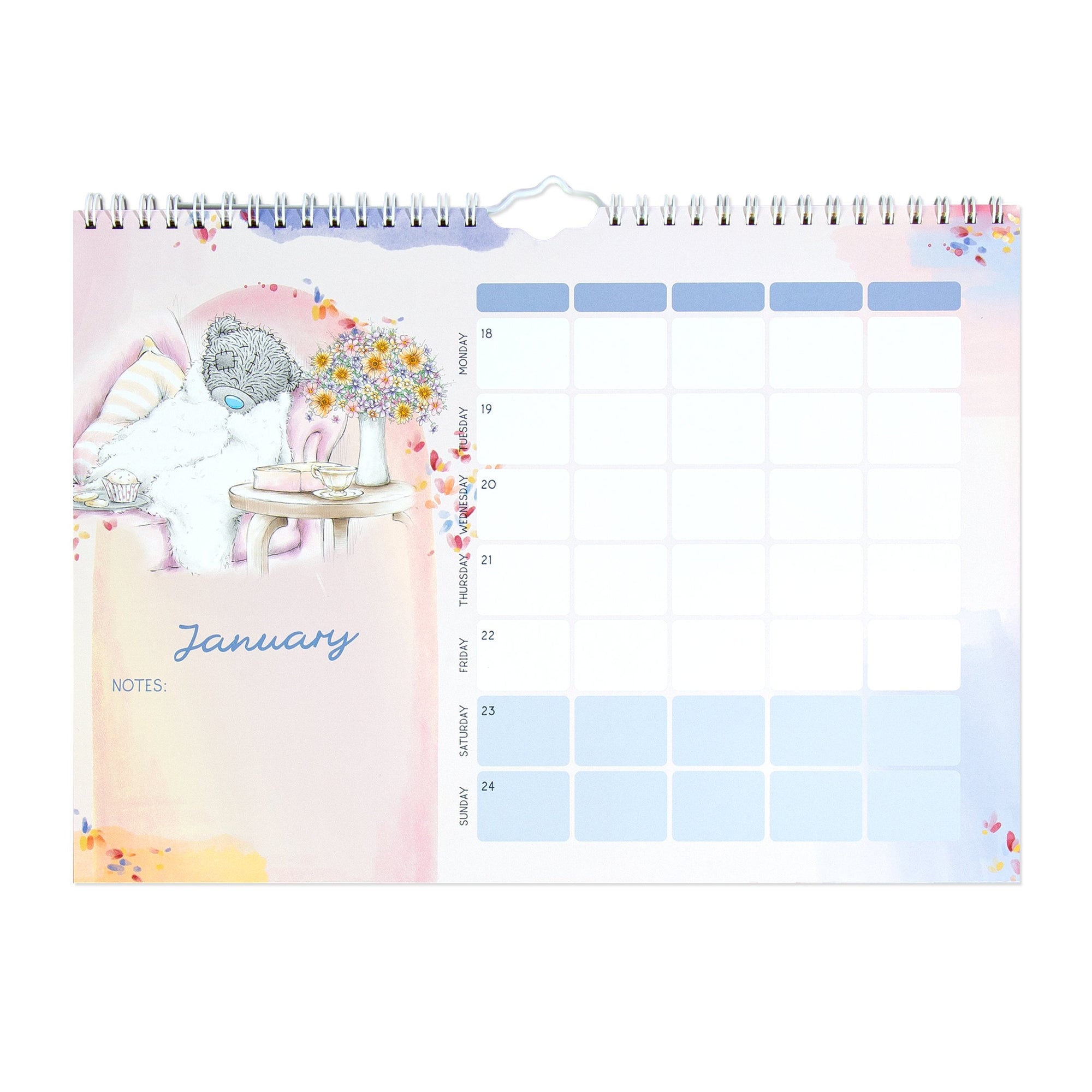 A spiral-bound monthly desk calendar page shown flat against a white background. The left side features a pastel illustration of a teddy bear in a pink armchair with flowers and the word 'January,' plus a notes section.