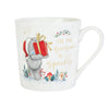 White mug with a Christmas design featuring a bear holding a gift and text 'Tis the season to sparkle' on a white background.