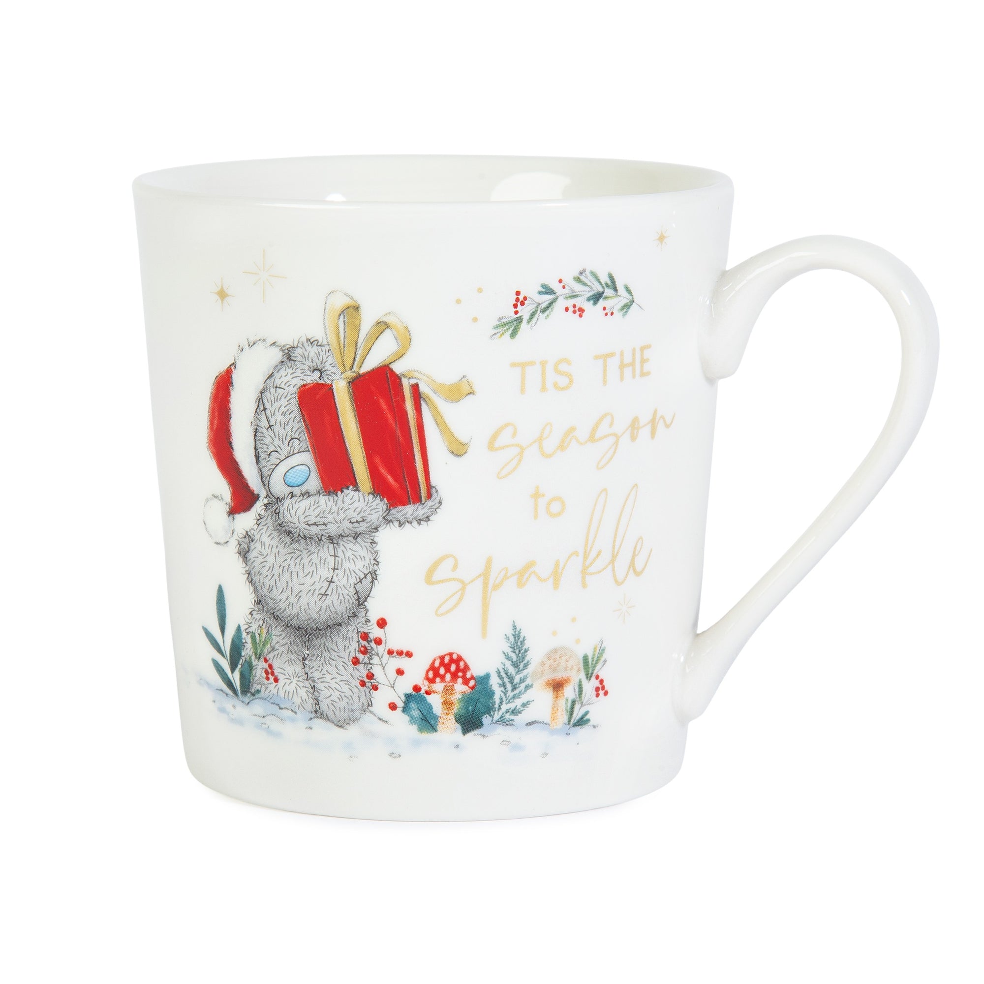 White mug with a Christmas design featuring a bear holding a gift and text 'Tis the season to sparkle' on a white background.